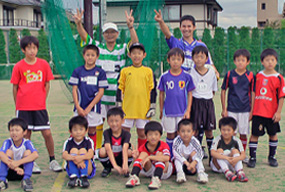 サッカー少年とコーチ